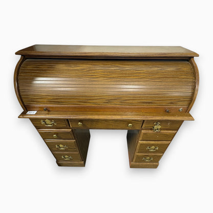GDM Habitat for Humanity ReStore oak roll-top desk with multiple drawers and brass hardware in a traditional style