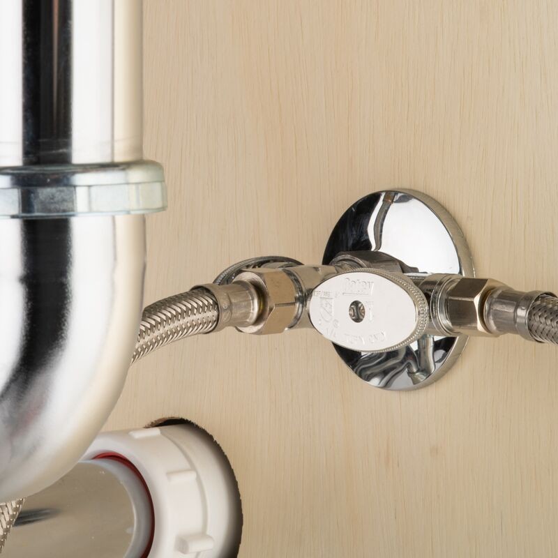 GDM Habitat for Humanity ReStore Oatey chrome straight stop valve installed on a light wood cabinet wall
