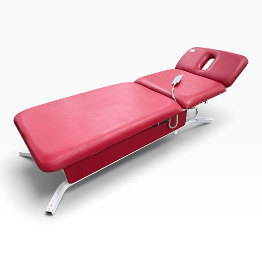 GDM Habitat for Humanity ReStore Dynatronics exam table in red vinyl with an adjustable headrest and hand control.