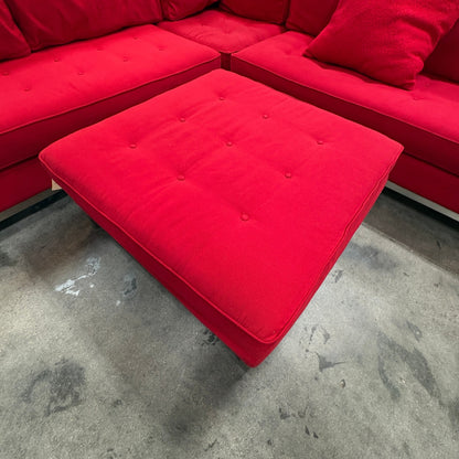 GDM Habitat for Humanity ReStore large red sectional sofa with tufted seat cushions and matching square ottoman