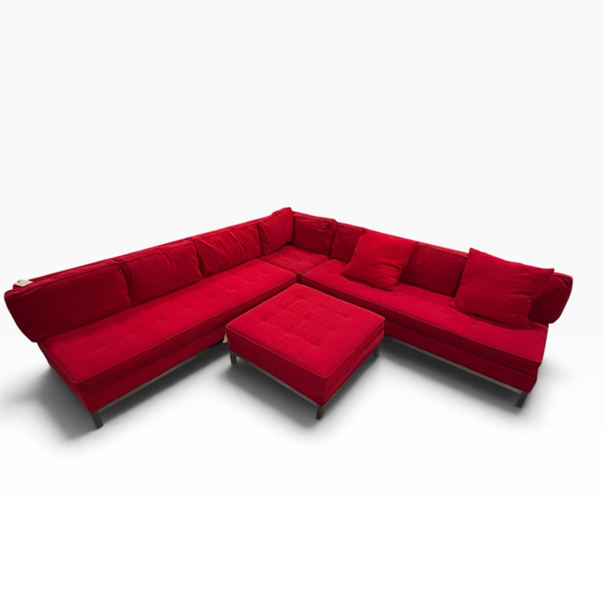 GDM Habitat for Humanity ReStore large red sectional sofa with tufted seat cushions and matching square ottoman