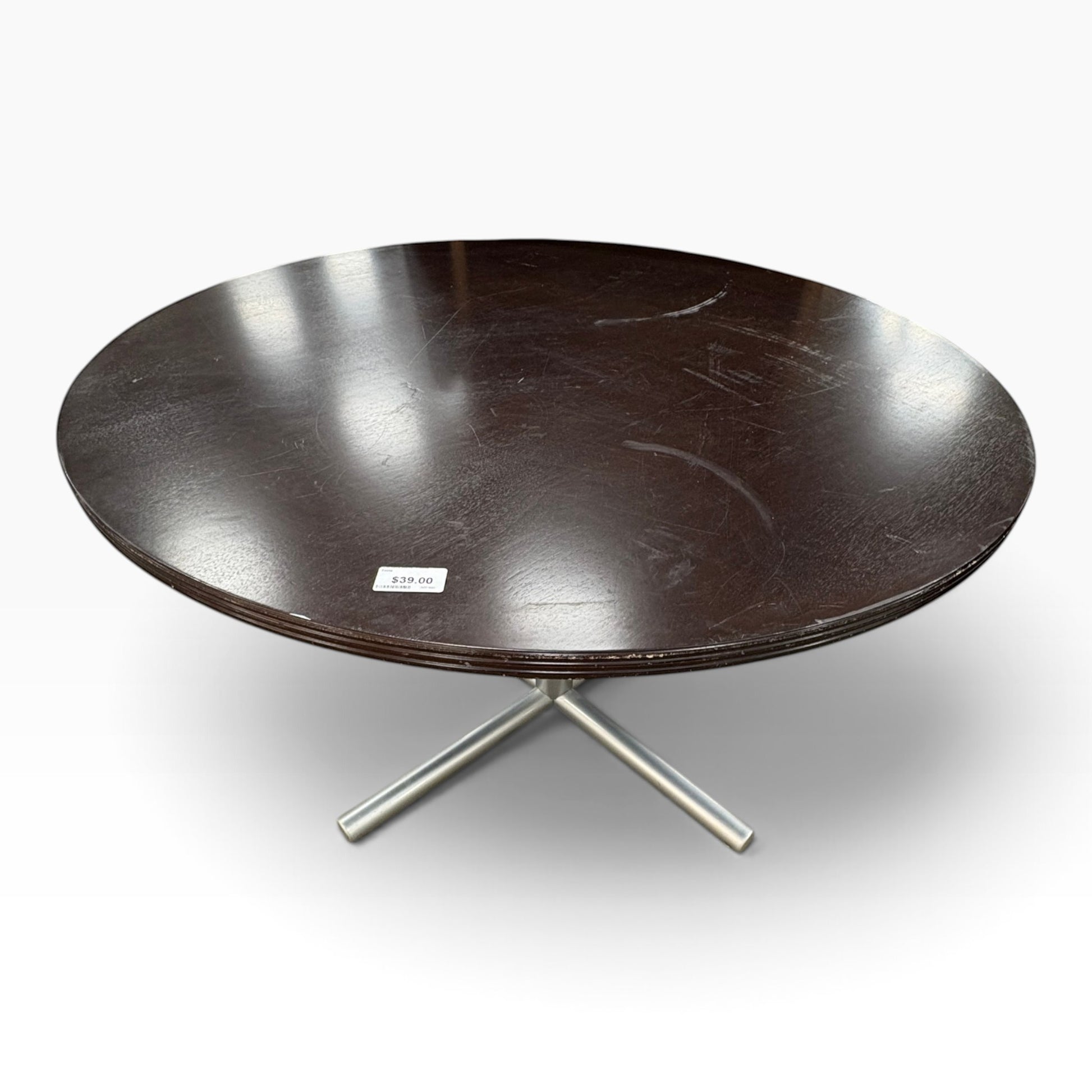 GDM Habitat for Humanity ReStore round dark brown wooden dining table with a modern silver metal cross base