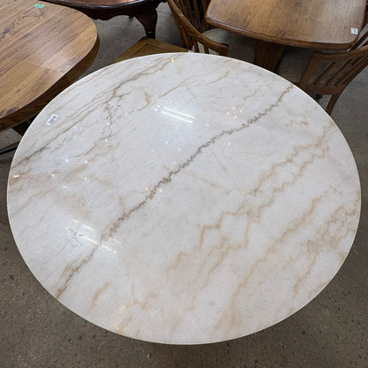 GDM Habitat for Humanity ReStore round table with a cream and brown marble-look finish and smooth surface