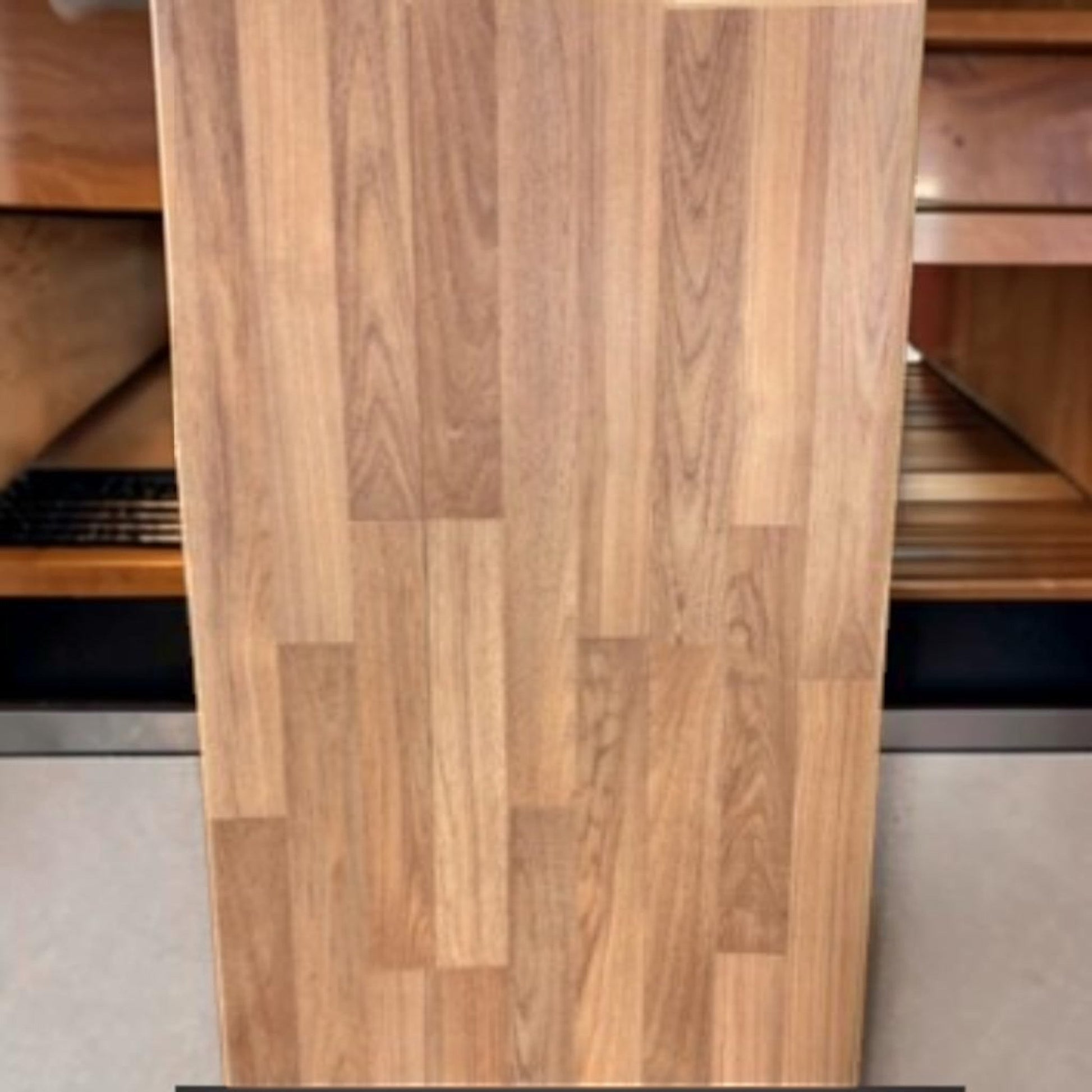 GDM Habitat for Humanity ReStore Soho Teak laminate flooring plank with a realistic wood grain pattern