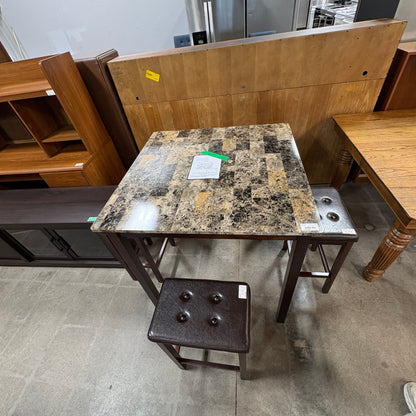 GDM Habitat for Humanity ReStore square dining table with faux marble top and four button-tufted brown leather stools.