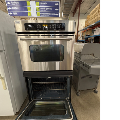 GDM Habitat for Humanity ReStore stainless steel double wall oven with open bottom door in a retail warehouse