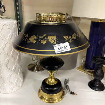 GDM Habitat for Humanity ReStore Tole ivy table lamp with a black metal shade, gold leaf detailing, and brass base.