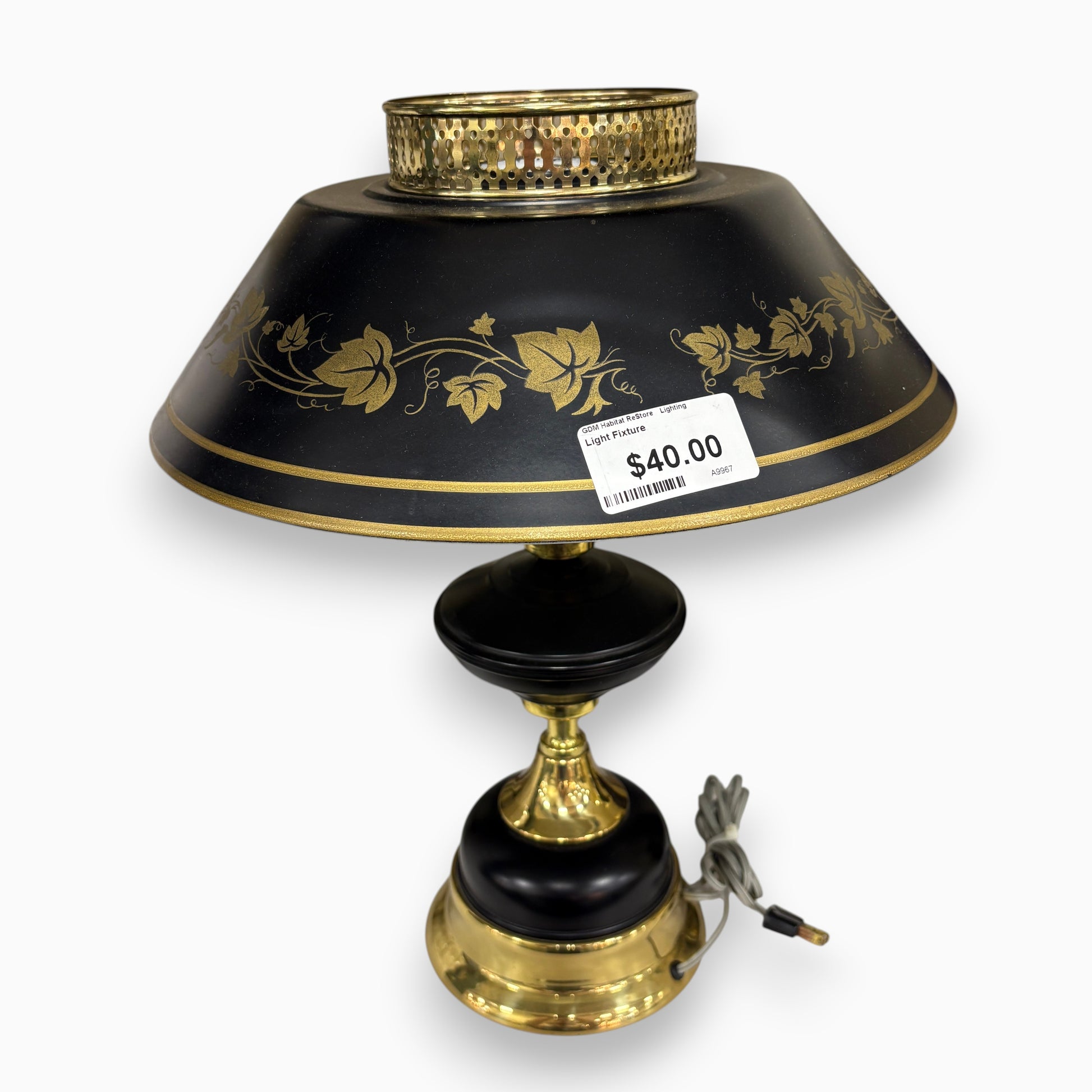 GDM Habitat for Humanity ReStore Tole ivy table lamp with a black metal shade, gold leaf detailing, and brass base.