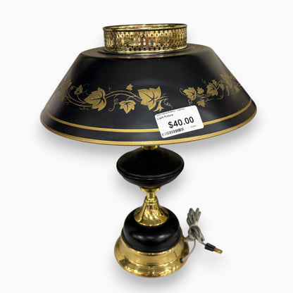 GDM Habitat for Humanity ReStore Tole ivy table lamp with a black metal shade, gold leaf detailing, and brass base.