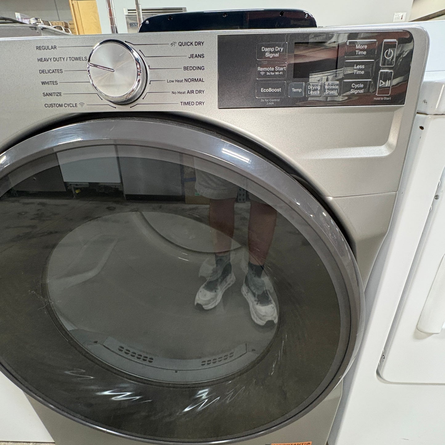 GDM Habitat for Humanity ReStore Whirlpool electric dryer with metallic finish, glass door, and digital control panel.