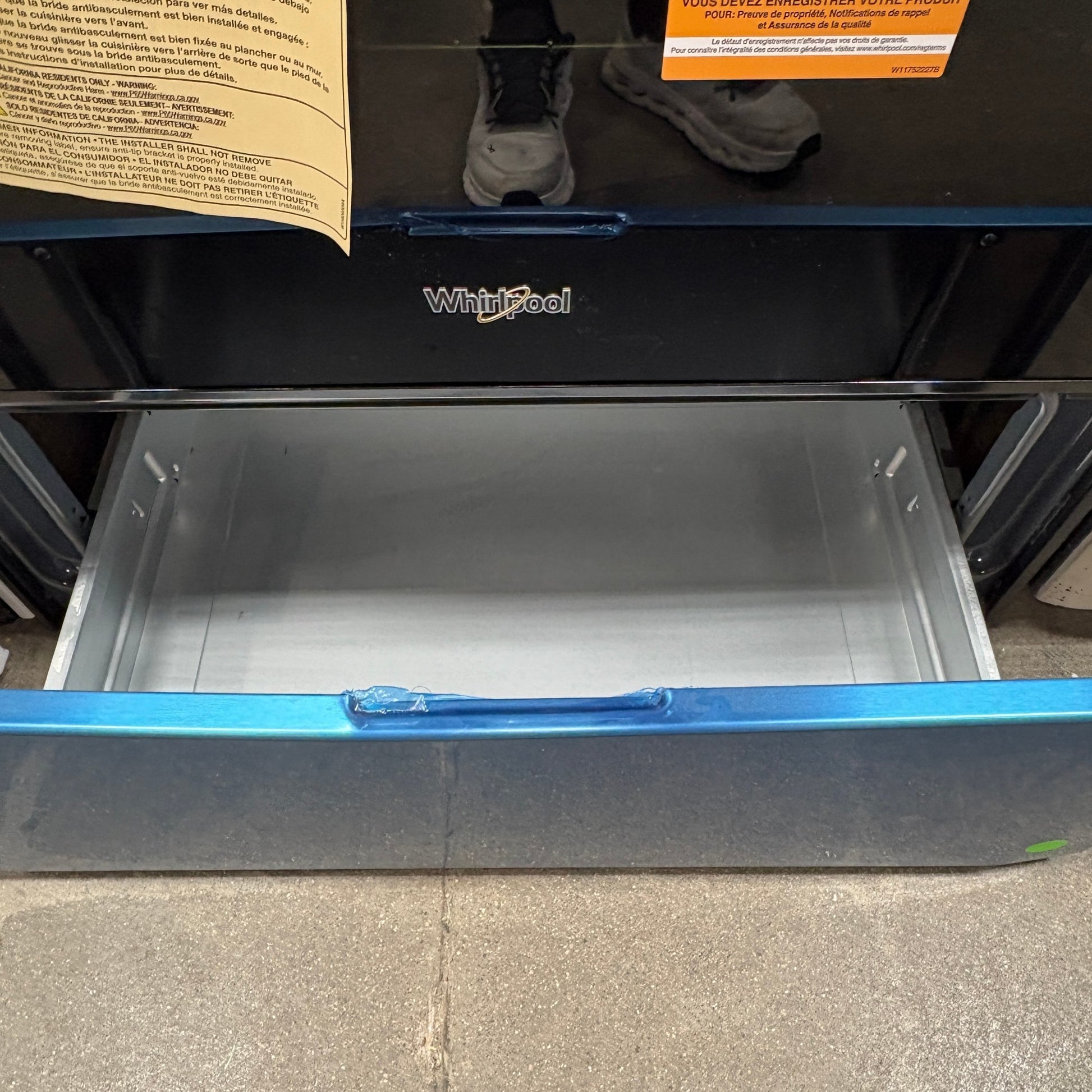 GDM Habitat for Humanity ReStore Whirlpool electric range featuring a sleek black finish and an open storage drawer