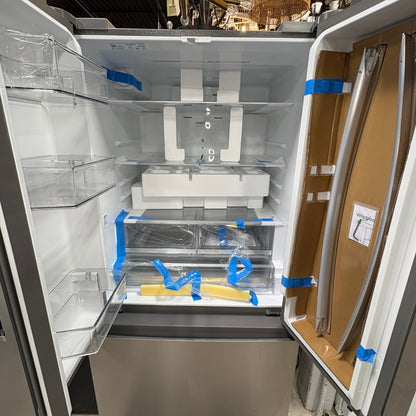 GDM Habitat for Humanity ReStore Whirlpool French door refrigerator interior with protective packaging and shelving