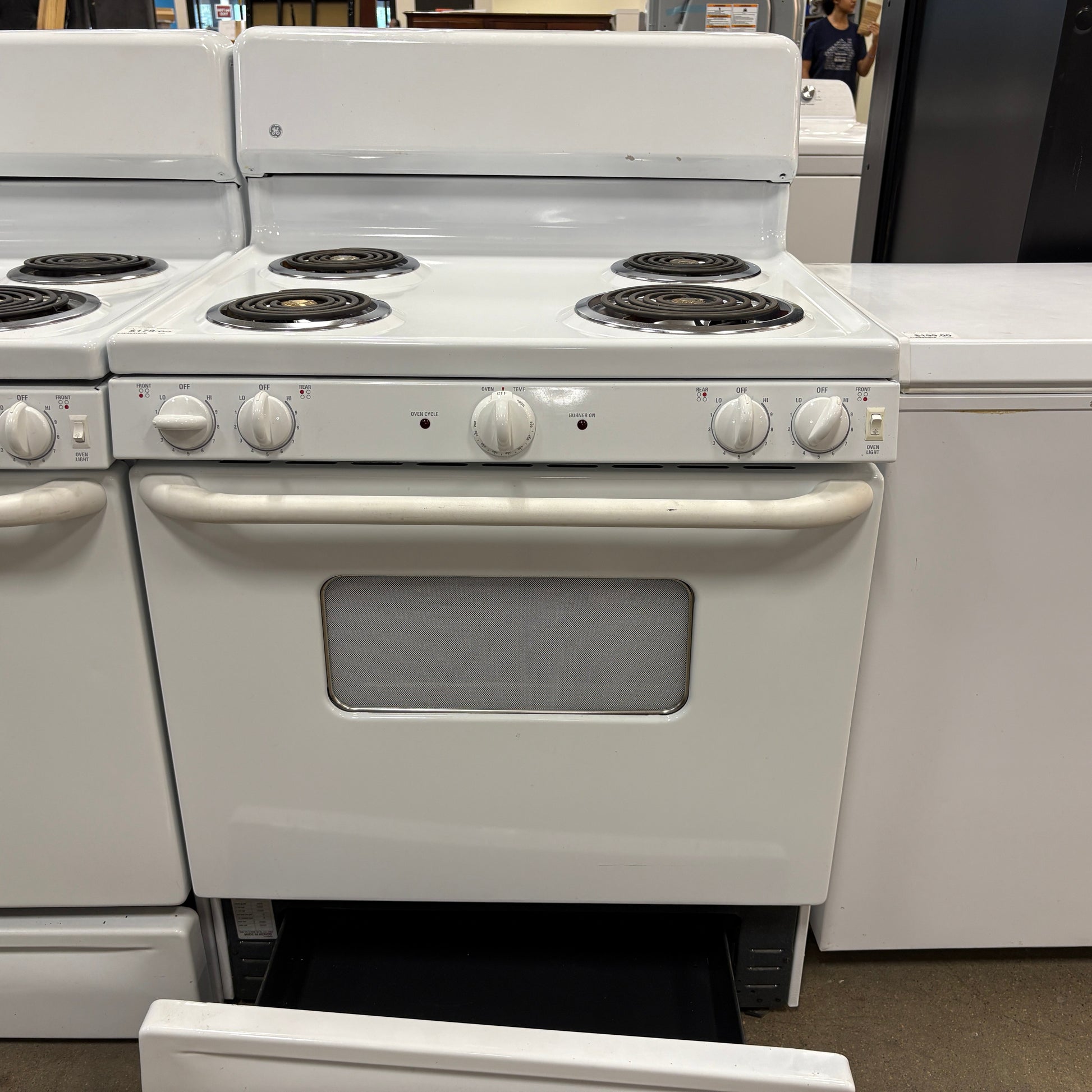 GDM Habitat for Humanity ReStore white GE electric range with four coil burners and a bottom storage drawer