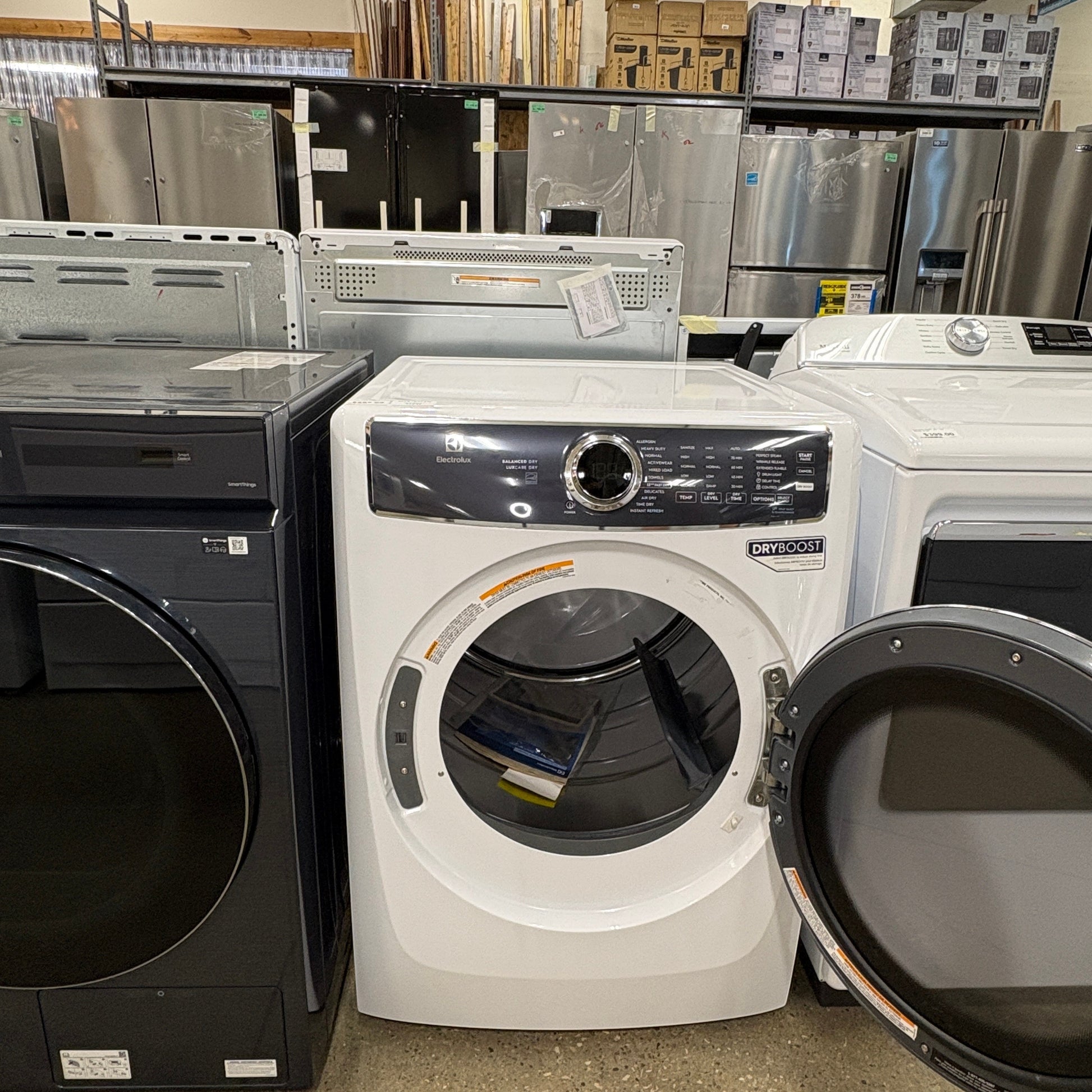 GDM Habitat for Humanity ReStore white Electrolux front load dryer with open door in a retail appliance showroom
