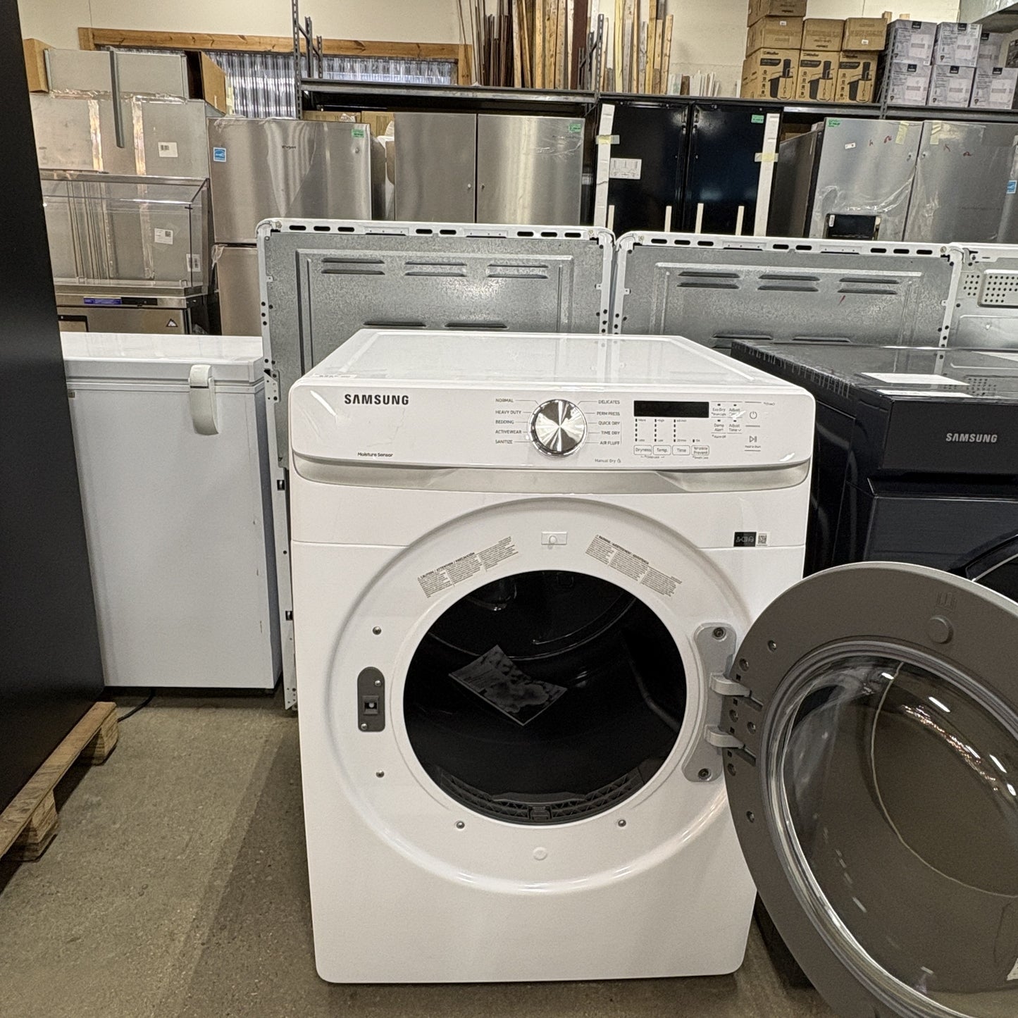 GDM Habitat for Humanity ReStore white Samsung front load electric dryer with open door in a warehouse setting