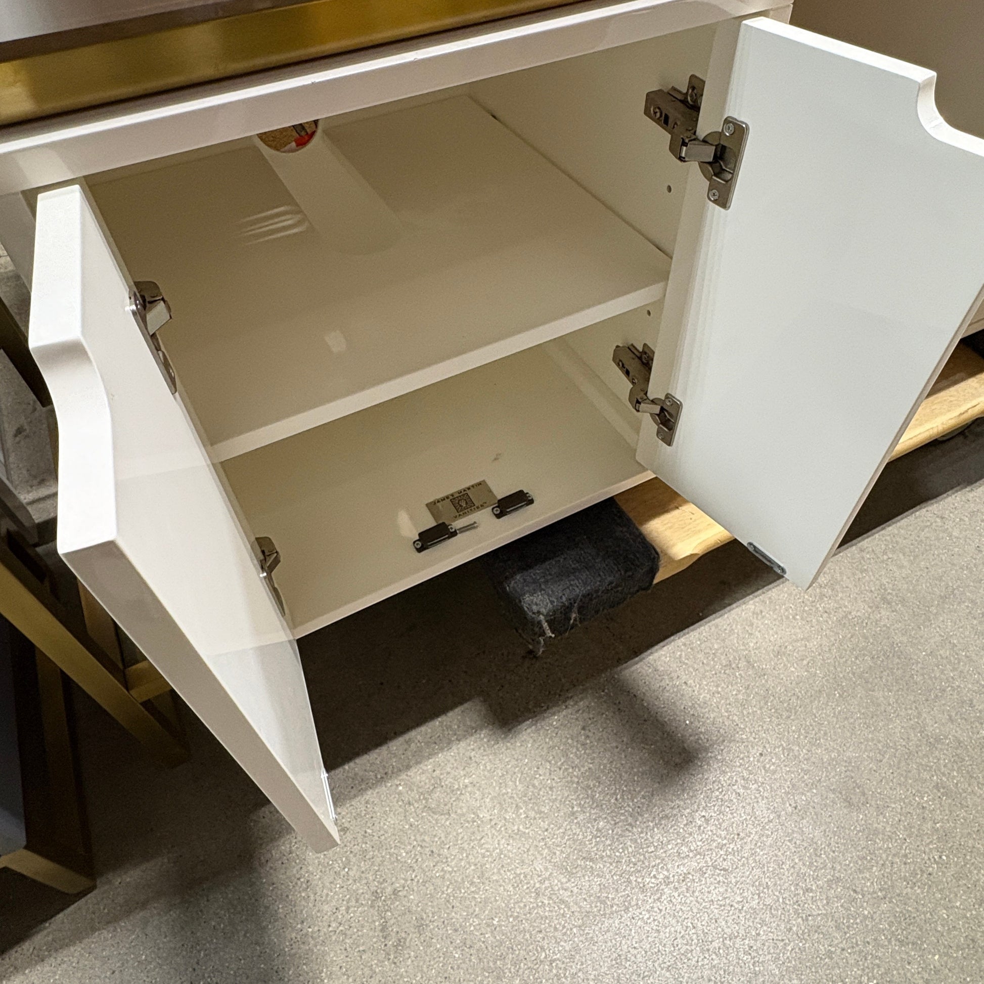 GDM Habitat for Humanity ReStore white bathroom vanity cabinet with open doors and internal storage shelf