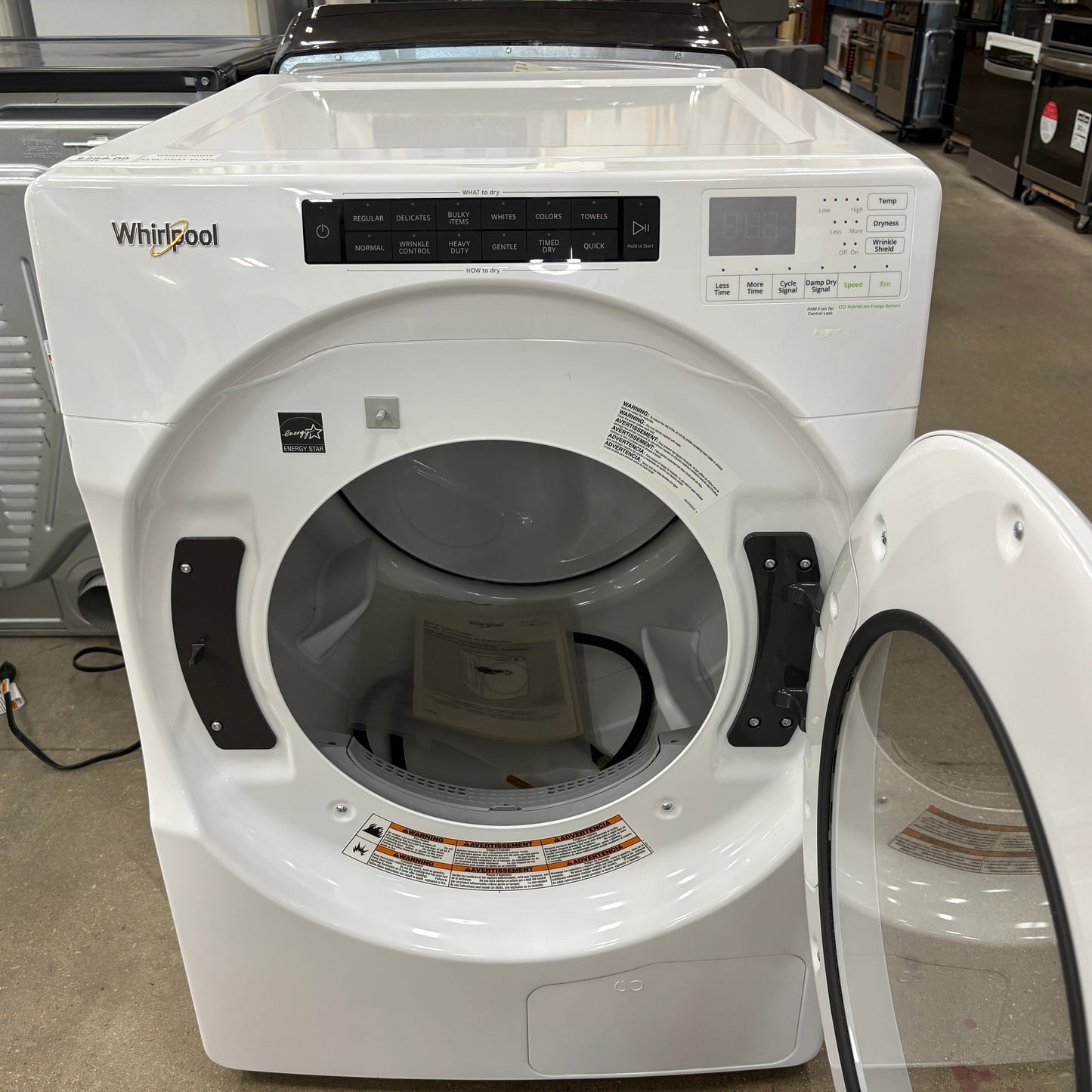 GDM Habitat for Humanity ReStore white Whirlpool front load dryer with open door and digital control panel