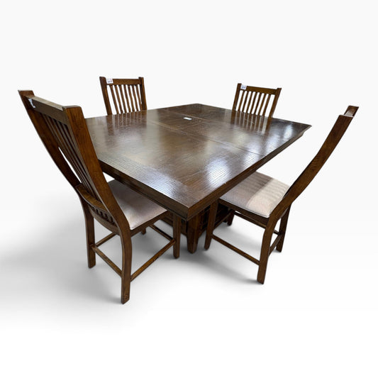 GDM Habitat for Humanity ReStore solid wood dining set with rectangular table and four slat-back chairs in tan fabric.