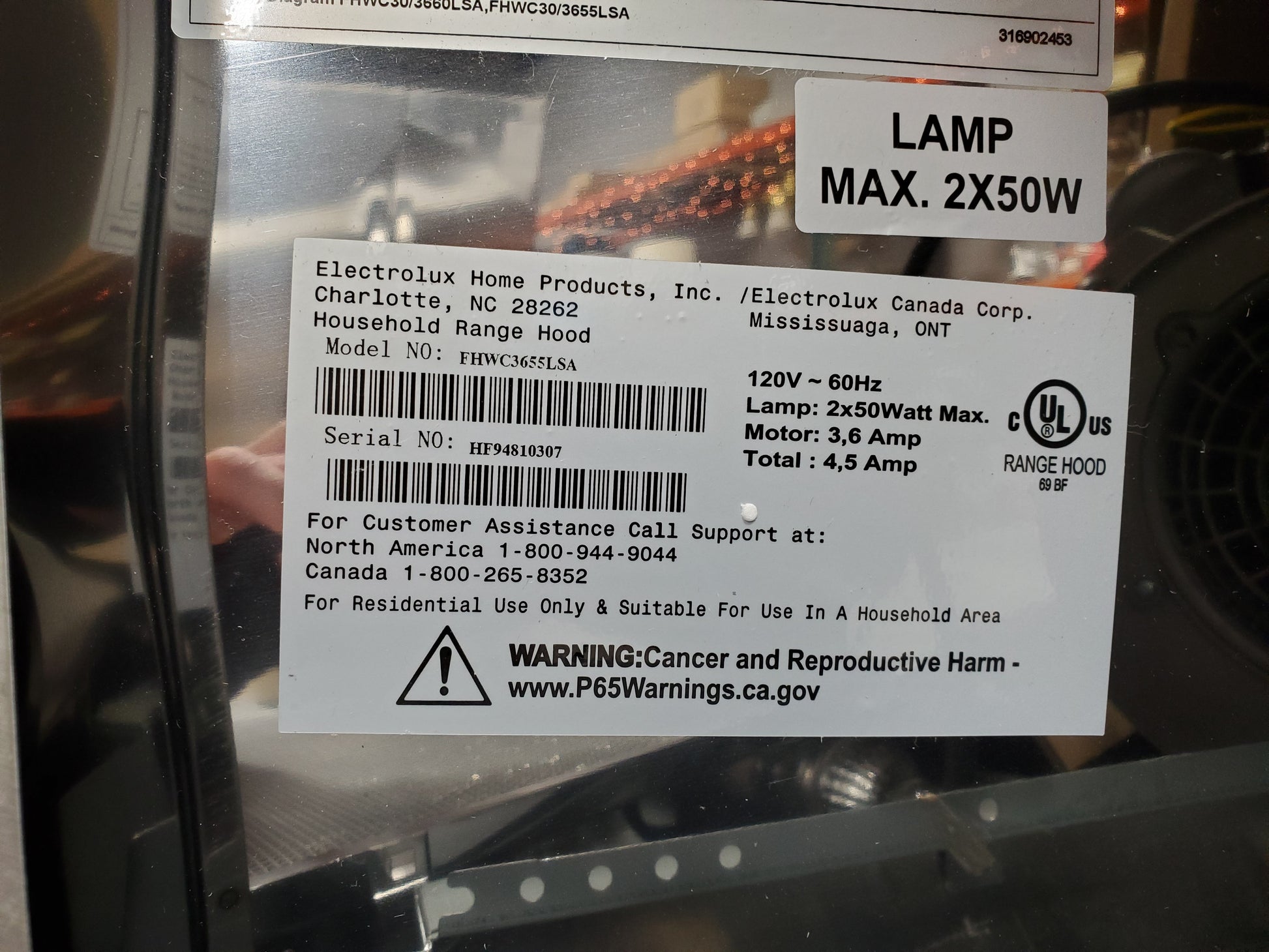 Brand, Model #, and Serial # for stainless steel range hood. Brand: Electrolux. Model #: FHWC3655LSA. Serial #: HF94810307. Electrical information: 120V ~ 60Hz. Lamp: 2x50Watt Max. Motor: 3,6 Amp. Total: 4,5 Amp.